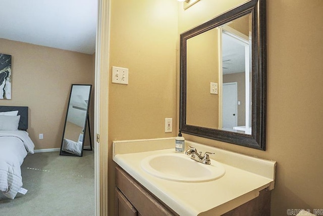 bathroom with baseboards and vanity