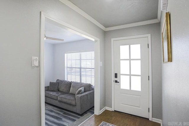 doorway with baseboards and crown molding