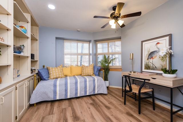 bedroom with baseboards and light wood-type flooring