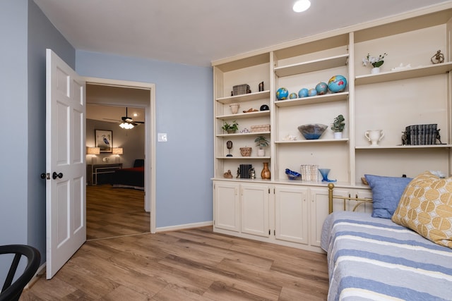 bedroom featuring light wood-style flooring and baseboards