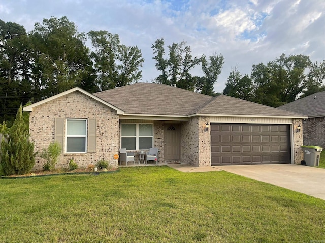 ranch-style house featuring brick siding, driveway, a front yard, and an attached garage