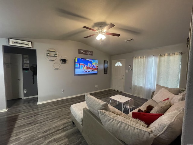 living room featuring visible vents, a ceiling fan, wood finished floors, baseboards, and vaulted ceiling