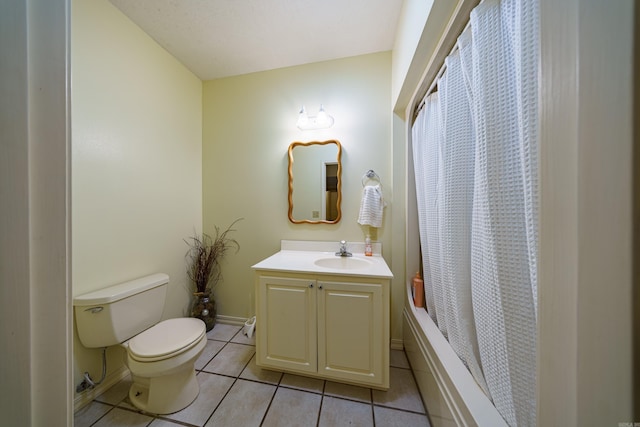 bathroom featuring toilet, curtained shower, tile patterned flooring, baseboards, and vanity