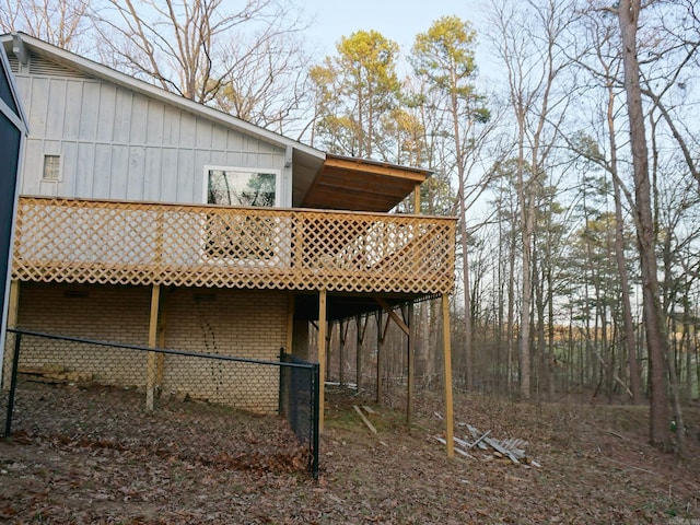 exterior space featuring a wooden deck and board and batten siding