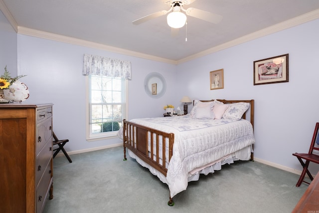 carpeted bedroom with a ceiling fan, crown molding, and baseboards