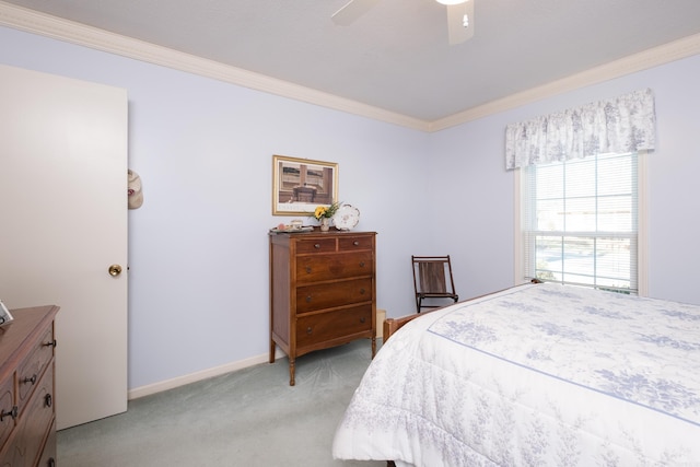 bedroom with ceiling fan, baseboards, light colored carpet, and ornamental molding