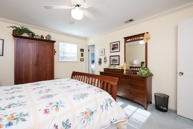 bedroom with light carpet, visible vents, ceiling fan, and ornamental molding