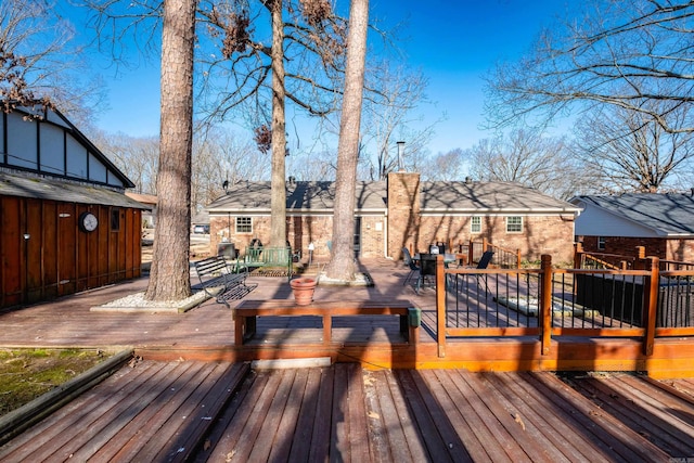 wooden deck featuring outdoor dining space