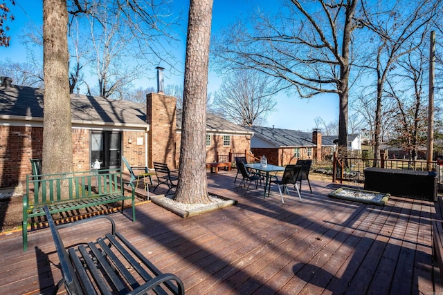 wooden deck with outdoor dining space