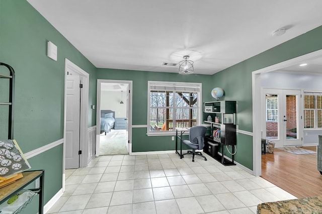 office space with light tile patterned floors, french doors, baseboards, and visible vents