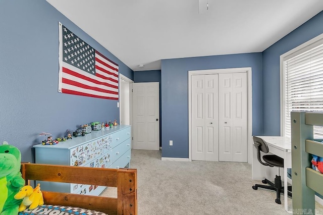 carpeted bedroom with a closet