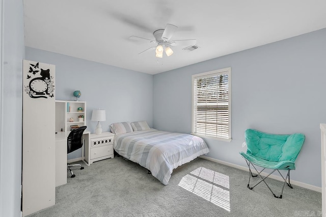 bedroom featuring visible vents, carpet floors, baseboards, and ceiling fan