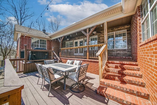 wooden terrace featuring outdoor dining space