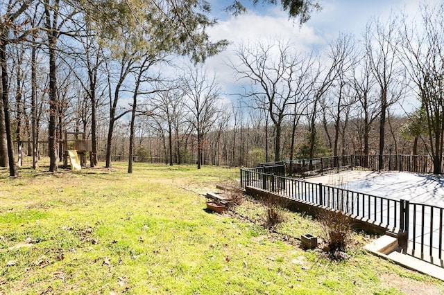 view of yard with a forest view