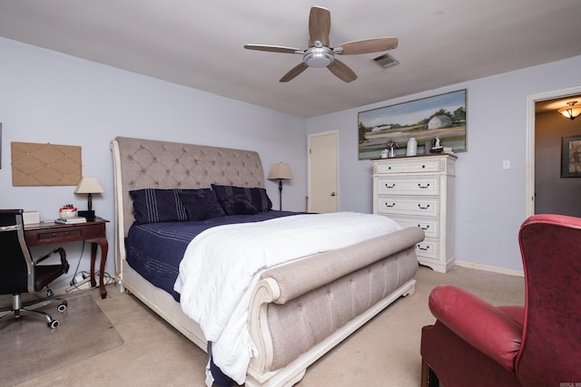 bedroom with baseboards, light colored carpet, visible vents, and ceiling fan