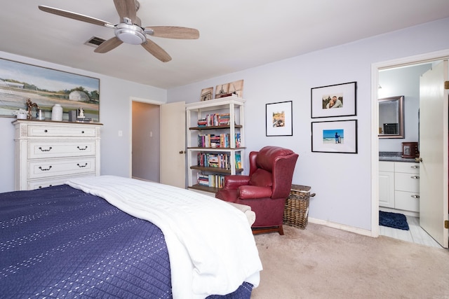 bedroom featuring visible vents, a ceiling fan, connected bathroom, carpet, and baseboards