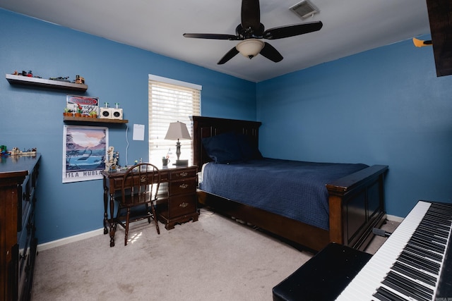 carpeted bedroom with visible vents, ceiling fan, and baseboards