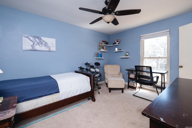 carpeted bedroom featuring a ceiling fan and baseboards