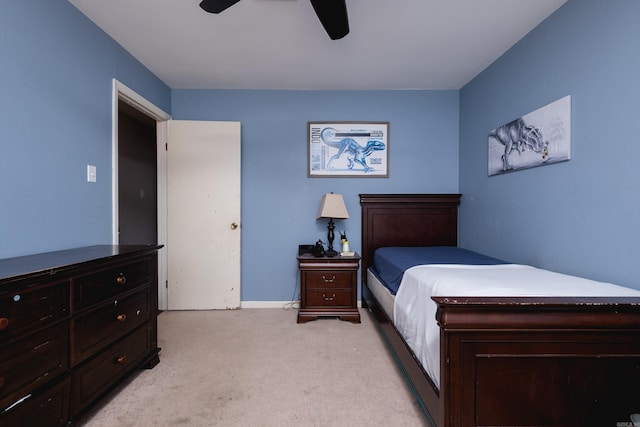 bedroom featuring a ceiling fan and light carpet