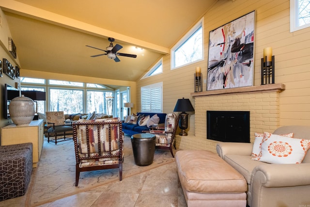 living room featuring beam ceiling, a healthy amount of sunlight, and wood walls