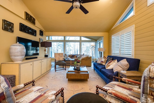 living room with lofted ceiling, a ceiling fan, and light carpet