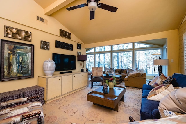 living room with visible vents, beam ceiling, high vaulted ceiling, light colored carpet, and ceiling fan