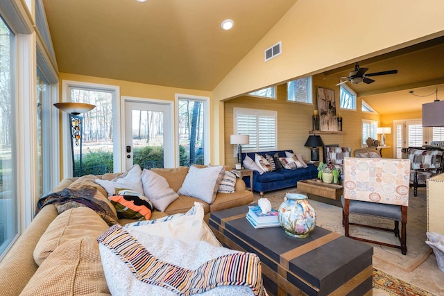 living room with ceiling fan, recessed lighting, visible vents, and high vaulted ceiling