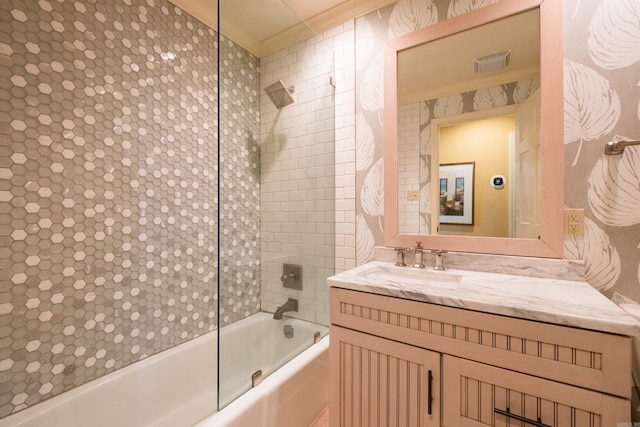 bathroom featuring visible vents, vanity, and shower / bath combination