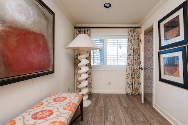 bedroom with hardwood / wood-style flooring and crown molding