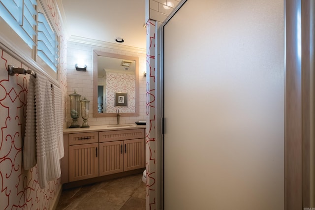 bathroom featuring vanity, ornamental molding, decorative backsplash, a shower stall, and tile patterned floors