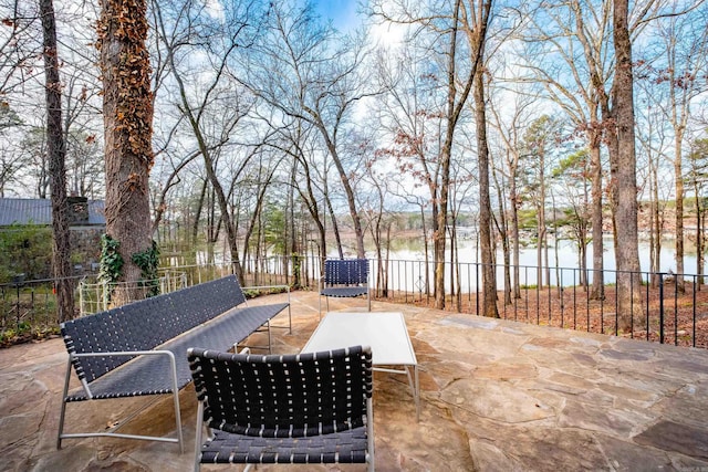 view of patio featuring an outdoor hangout area and fence