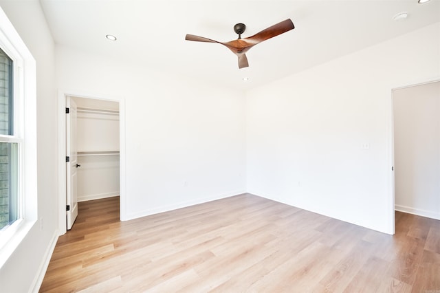 unfurnished room featuring baseboards, recessed lighting, light wood-type flooring, and ceiling fan