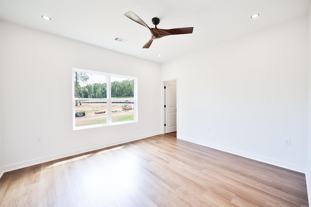 empty room with recessed lighting, visible vents, baseboards, and light wood-style floors