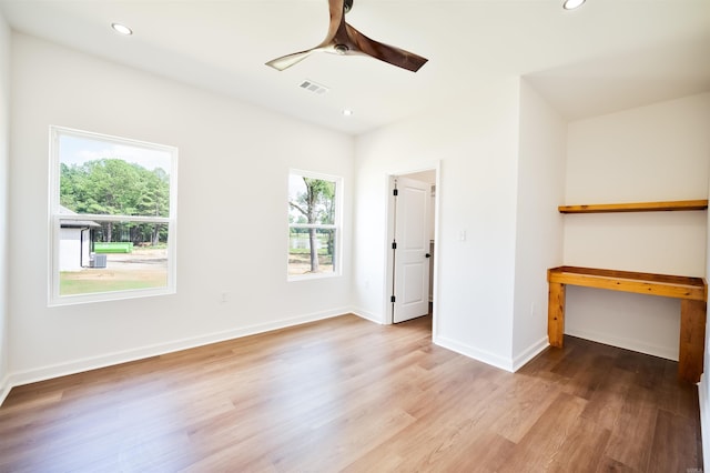 unfurnished bedroom with visible vents, ceiling fan, baseboards, recessed lighting, and wood finished floors