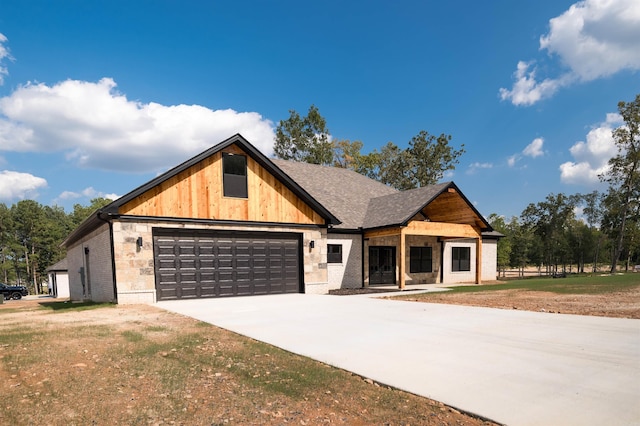 view of front of property featuring an attached garage, brick siding, driveway, and roof with shingles