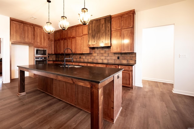 kitchen with dark countertops, built in microwave, and backsplash