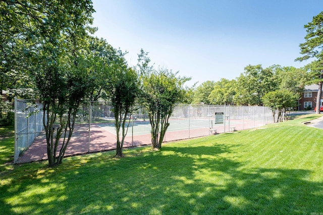 exterior space featuring a lawn and fence