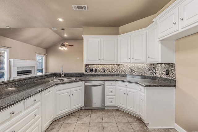 kitchen with visible vents, a ceiling fan, a sink, white cabinets, and dishwasher