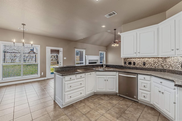 kitchen with a ceiling fan, visible vents, a peninsula, a sink, and dishwasher