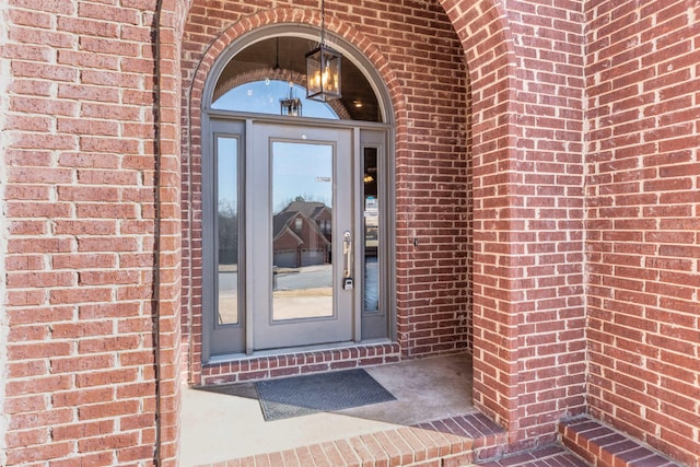 entrance to property with brick siding