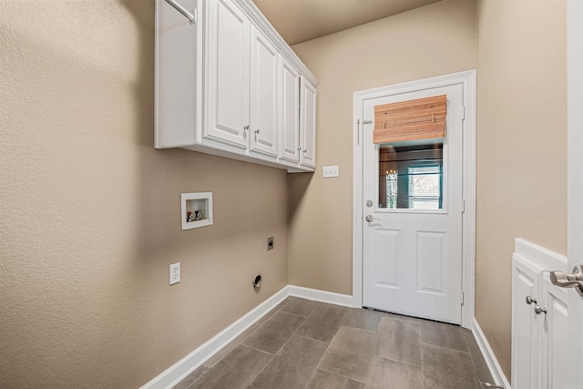 laundry room featuring hookup for a washing machine, cabinet space, baseboards, and hookup for an electric dryer