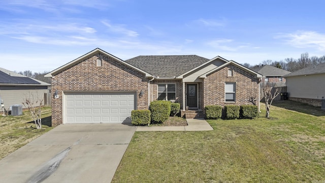 ranch-style house featuring a front yard, concrete driveway, a garage, central air condition unit, and brick siding