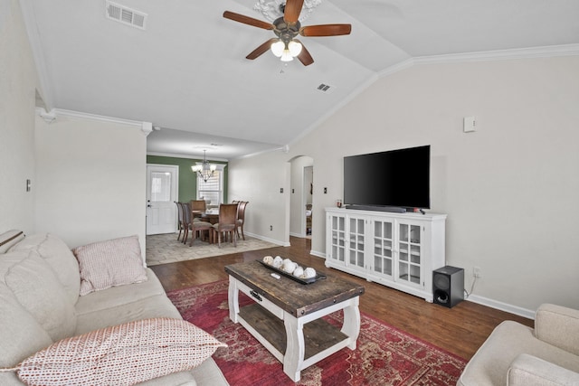 living room featuring visible vents, arched walkways, wood finished floors, and vaulted ceiling