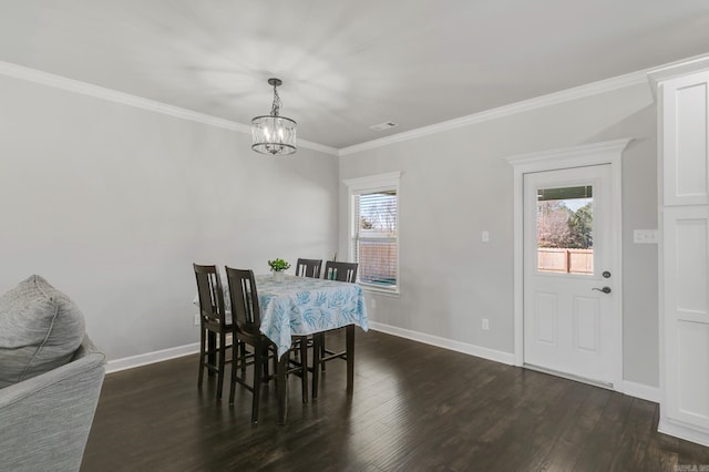 dining room with visible vents, dark wood-type flooring, baseboards, a chandelier, and ornamental molding