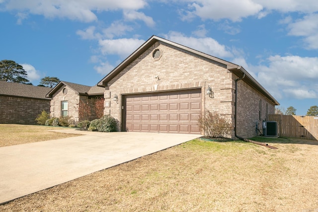 ranch-style home with fence, driveway, a front lawn, a garage, and brick siding