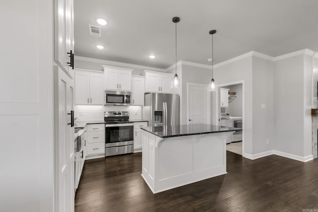 kitchen featuring visible vents, decorative backsplash, white cabinets, stainless steel appliances, and dark wood-style flooring