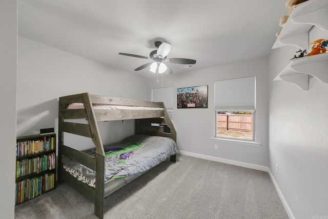 bedroom featuring carpet flooring, visible vents, a ceiling fan, and baseboards