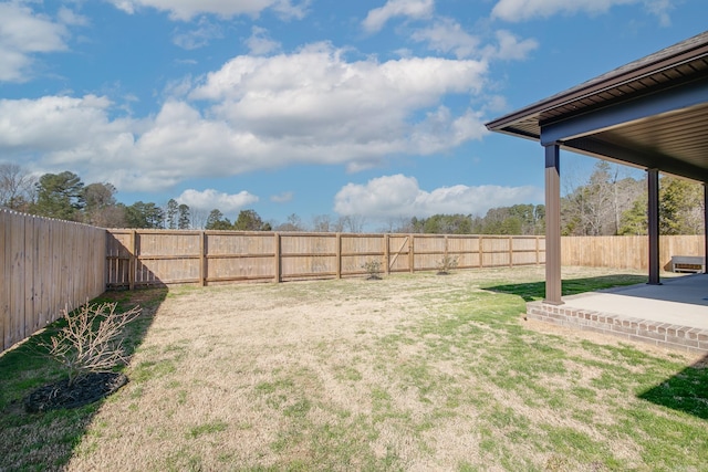 view of yard featuring a patio and a fenced backyard