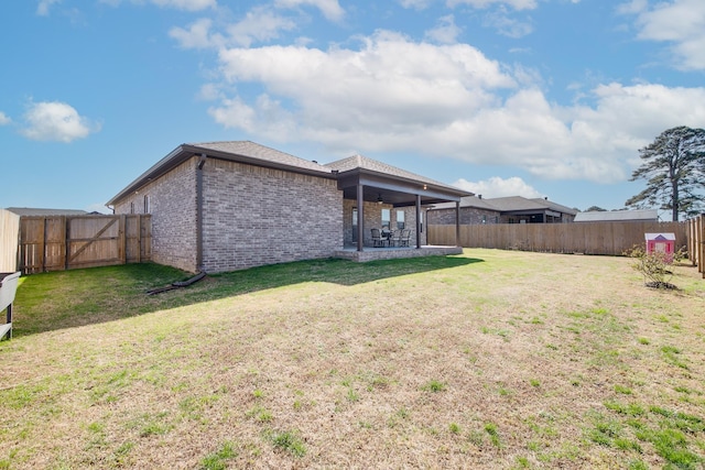 view of yard featuring a fenced backyard and a patio area