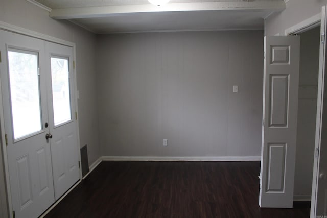 interior space with baseboards and dark wood-type flooring